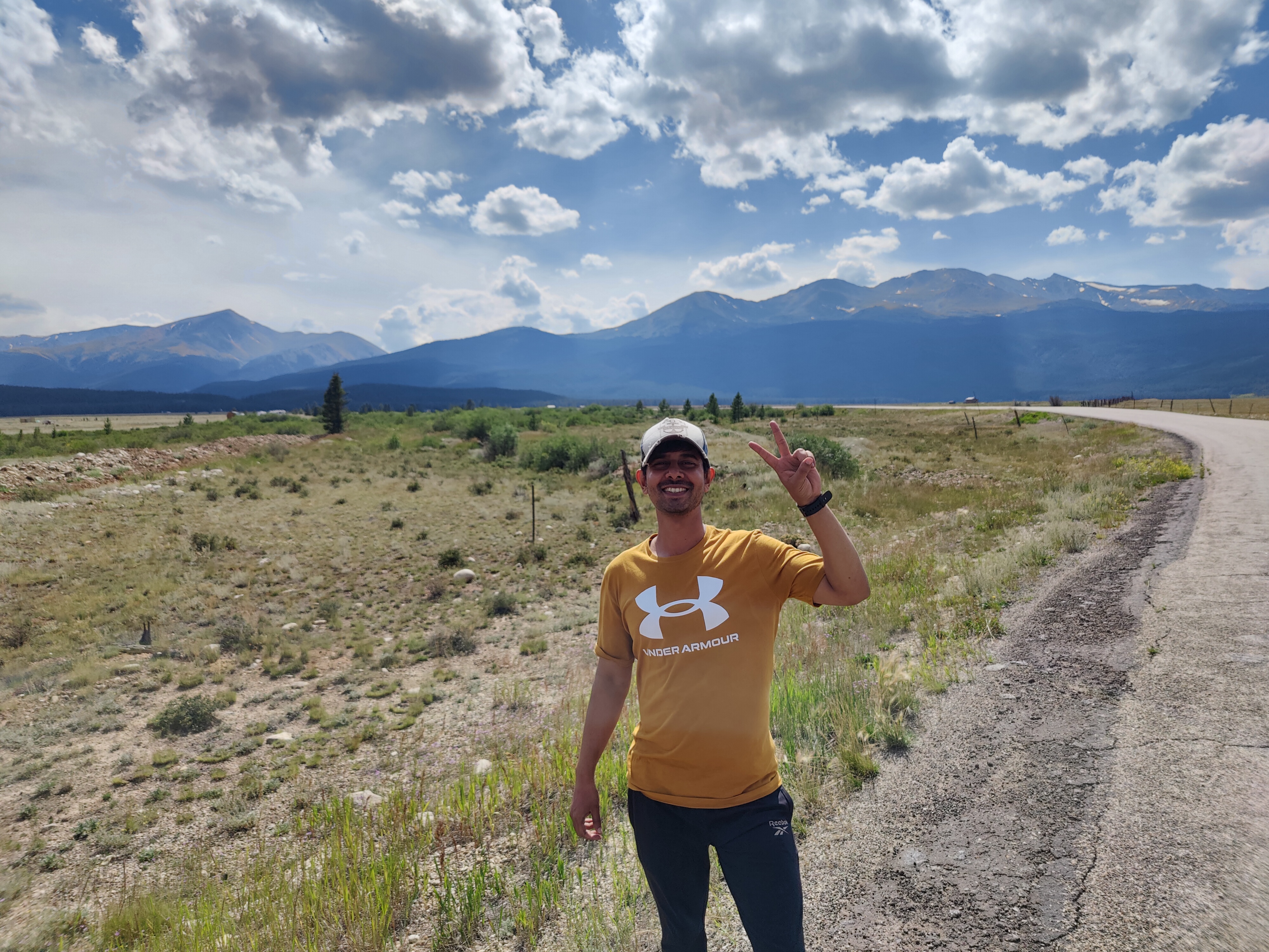Person holding sign at Mt. Democrat summit
